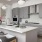 a kitchen with grey cabinets