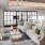 a living room with a large window and large couch