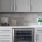 Model kitchen at our apartments for rent in Dallas, TX, featuring grey counters and stainless steel appliances.