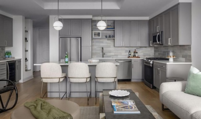 Beautiful living areas to match your lifestyle a kitchen with a dining table and chairs