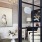 a room with a black glass door