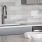 Detail of a model kitchen at our apartments for rent in Dallas, featuring a sink with stainless steel faucet and knobs.