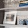 Detail of one of our apartments for rent in Dallas, TX, featuring a bookshelf with ceramics and photographs.