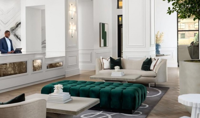 The essence of exceptional living a lobby with a chandelier and a couch